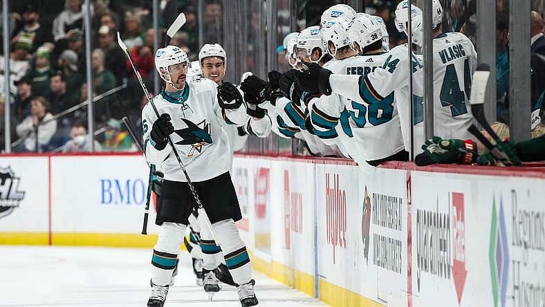 Nov 16, 2021; Saint Paul, Minnesota, USA; San Jose Sharks defenseman Erik Karlsson (65) celebrates with teammates after scoring a goal against the Minnesota Wild in the second period at Xcel Energy Center. Mandatory Credit: David Berding-USA TODAY Sports