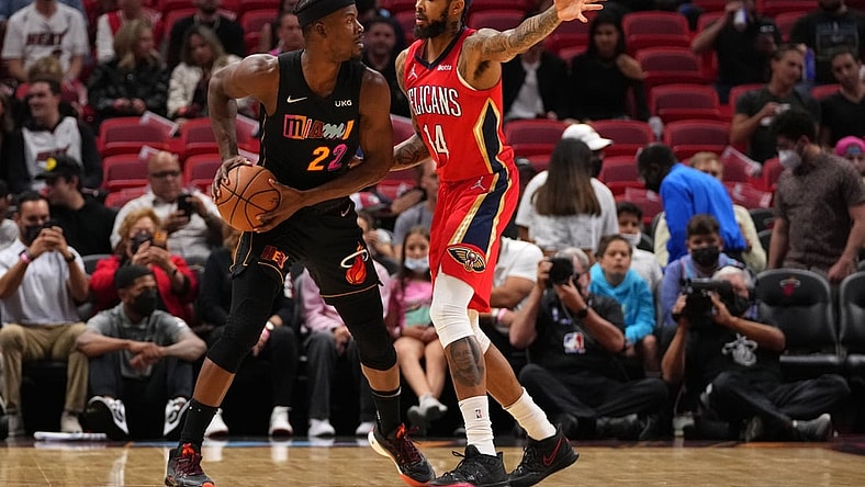 Nov 17, 2021; Miami, Florida, USA; Miami Heat forward Jimmy Butler (22) controls the ball around New Orleans Pelicans forward Brandon Ingram (14) during the first half at FTX Arena. Mandatory Credit: Jasen Vinlove-USA TODAY Sports