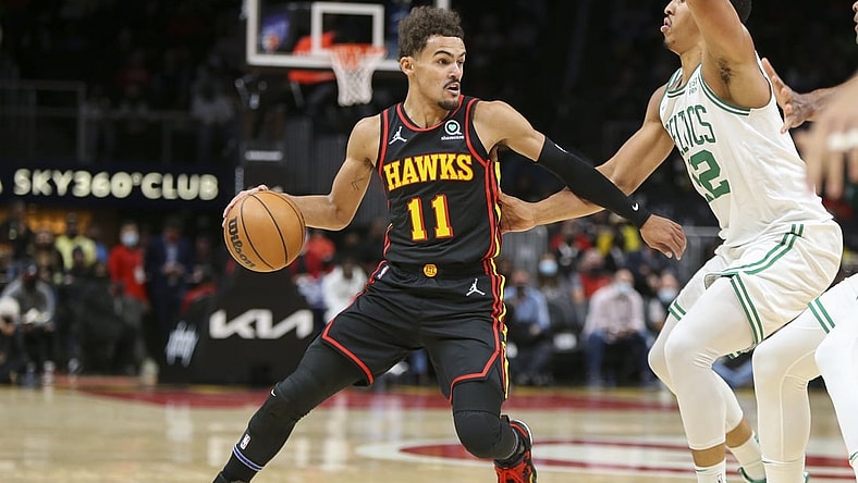 Nov 17, 2021; Atlanta, Georgia, USA; Atlanta Hawks guard Trae Young (11) is defended by Boston Celtics forward Grant Williams (12) in the first quarter at State Farm Arena. Mandatory Credit: Brett Davis-USA TODAY Sports