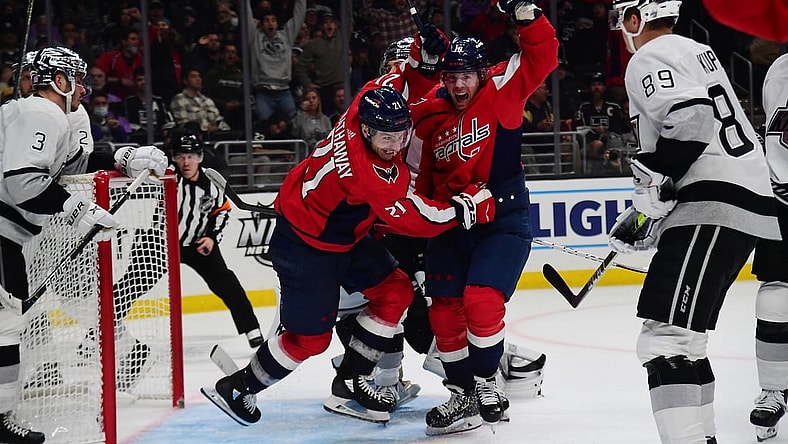 Nov 17, 2021; Los Angeles, California, USA; Washington Capitals right wing Garnet Hathaway (21) celebrates with right wing Daniel Sprong (10) his goal scored against the Los Angeles Kings during the third period at Staples Center. Mandatory Credit: Gary A. Vasquez-USA TODAY Sports