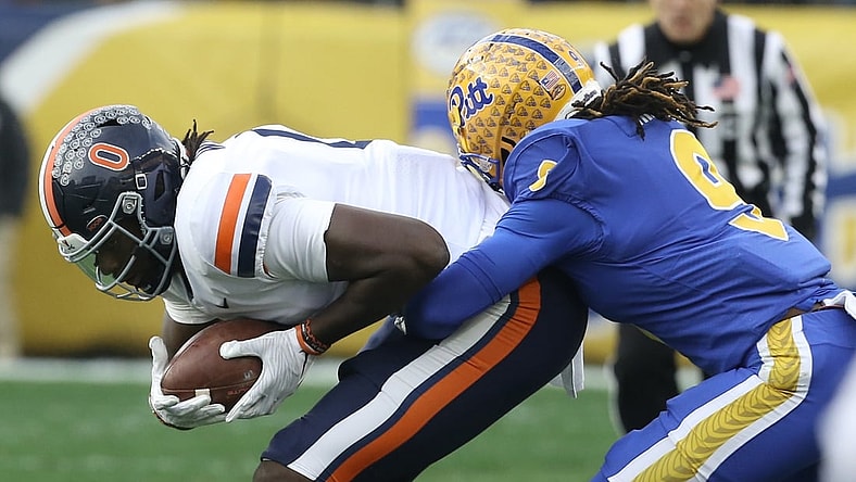 Nov 20, 2021; Pittsburgh, Pennsylvania, USA;  Virginia Cavaliers tight end Jelani Woods (0) is tackled after a catch against Pittsburgh Panthers defensive back Brandon Hill (9) during the first quarter at Heinz Field. Mandatory Credit: Charles LeClaire-USA TODAY Sports