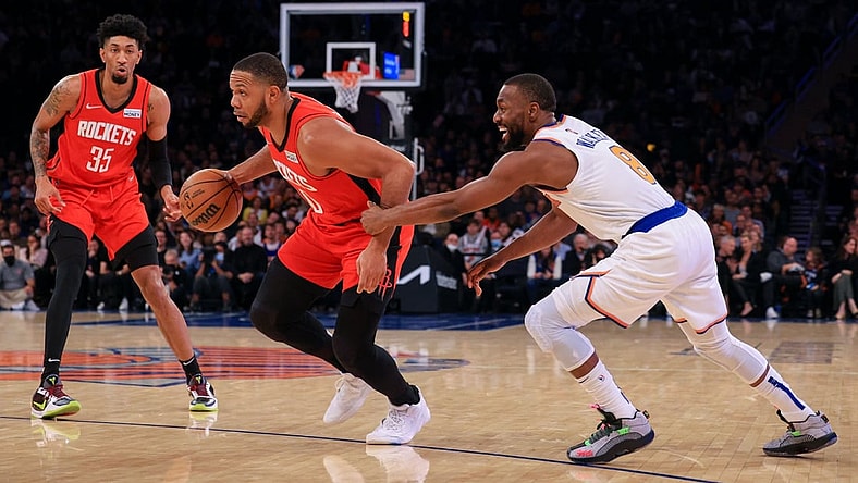 Nov 20, 2021; New York, New York, USA; Houston Rockets guard Eric Gordon (10) drives to the basket as New York Knicks guard Kemba Walker (8) defends in front of center Christian Wood (35) during the first half at Madison Square Garden. Mandatory Credit: Vincent Carchietta-USA TODAY Sports