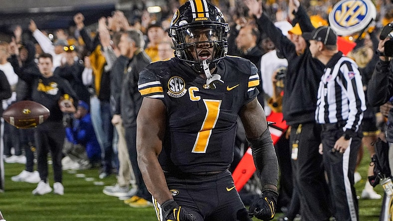 Nov 20, 2021; Columbia, Missouri, USA; Missouri Tigers running back Tyler Badie (1) celebrates after a play against the Florida Gators in overtime at Faurot Field at Memorial Stadium. Mandatory Credit: Denny Medley-USA TODAY Sports