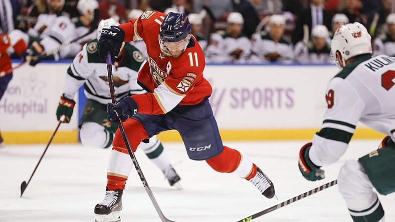 Nov 20, 2021; Sunrise, Florida, USA; Florida Panthers left wing Jonathan Huberdeau (11) shoots the puck against the Minnesota Wild during the third period at FLA Live Arena. Mandatory Credit: Sam Navarro-USA TODAY Sports