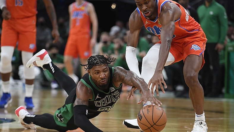 Nov 20, 2021; Boston, Massachusetts, USA;  Boston Celtics guard Marcus Smart (36) dives for a loose ball in front of Oklahoma City Thunder guard Shai Gilgeous-Alexander (2) during the second half at TD Garden. Mandatory Credit: Bob DeChiara-USA TODAY Sports