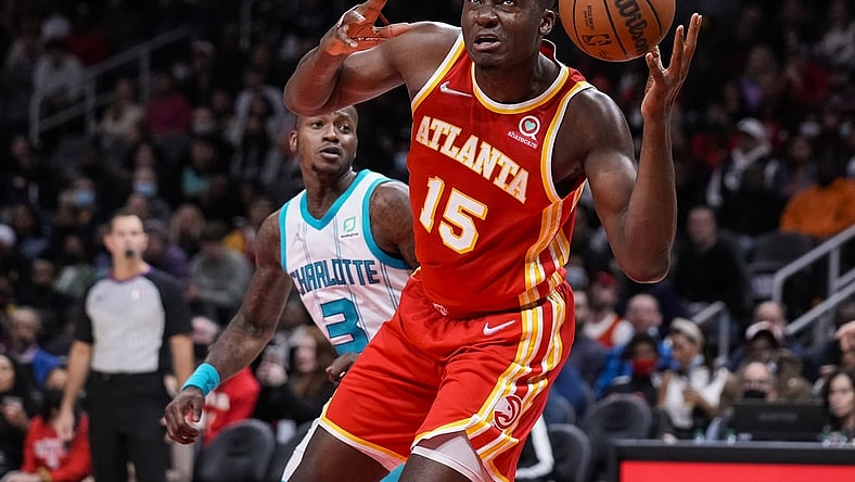 Nov 20, 2021; Atlanta, Georgia, USA; Atlanta Hawks center Clint Capela (15) controls a rebound against the Charlotte Hornets during the second half at State Farm Arena. Mandatory Credit: Dale Zanine-USA TODAY Sports