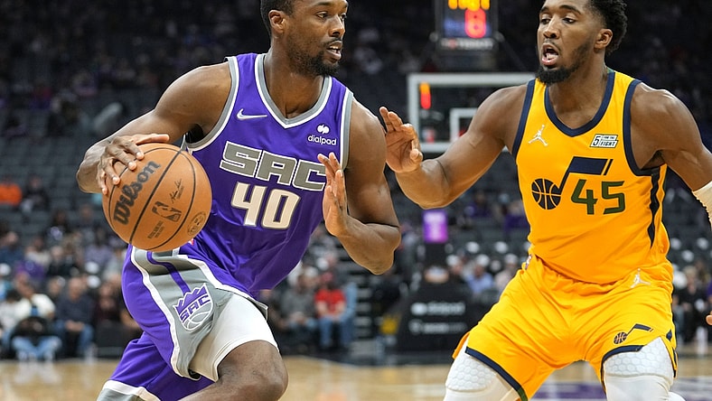 Nov 20, 2021; Sacramento, California, USA; Sacramento Kings forward Harrison Barnes (40) drives while being defended by Utah Jazz guard Donovan Mitchell (45) during the first quarter at Golden 1 Center. Mandatory Credit: Darren Yamashita-USA TODAY Sports