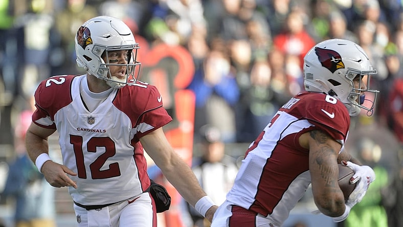 Nov 21, 2021; Seattle, Washington, USA; Arizona Cardinals quarterback Colt McCoy (12) hands the ball off to Arizona Cardinals running back James Conner (6) during the first half against the Seattle Seahawks at Lumen Field. Mandatory Credit: Steven Bisig-USA TODAY Sports