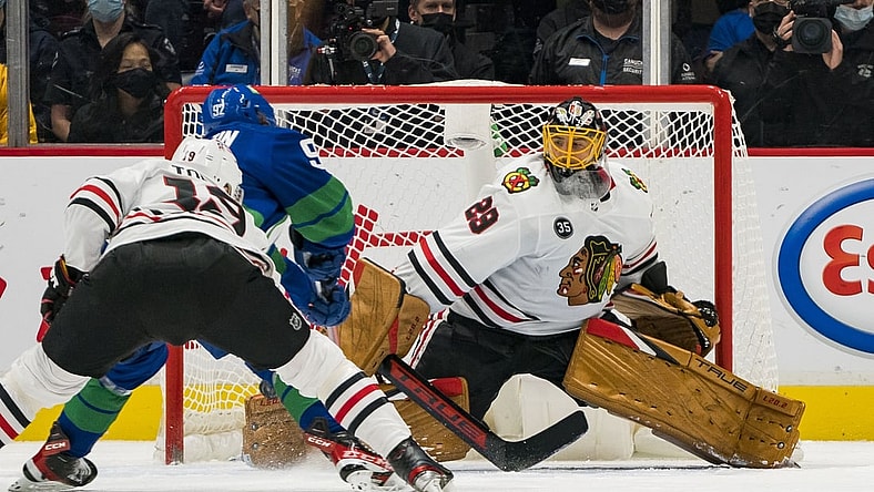 Nov 21, 2021; Vancouver, British Columbia, CAN; Chicago Blackhawks goalie Marc-Andre Fleury (29) makes a save on Vancouver Canucks forward Vasily Podkolzin (92) in the second period at Rogers Arena. Mandatory Credit: Bob Frid-USA TODAY Sports