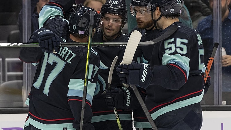 Nov 21, 2021; Seattle, Washington, USA;  Seattle Kraken center Jaden Schwartz (17), defenseman Adam Larsson (6) secon from right, defenseman Jeremy Lauzon (55) celebrate a goal by center Calle Jarnkrok (19 during the second period against the Washington Capitals)at Climate Pledge Arena. Mandatory Credit: Stephen Brashear-USA TODAY Sports