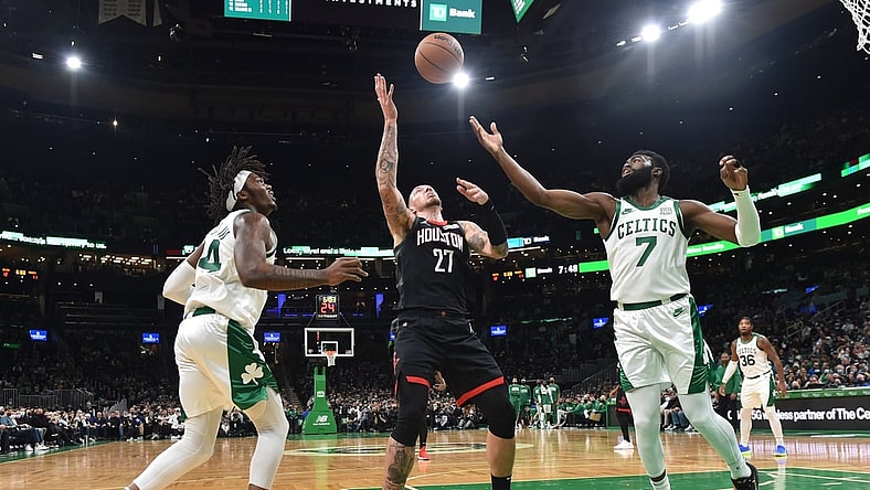 Nov 22, 2021; Boston, Massachusetts, USA;  Houston Rockets center Daniel Theis (27) and Boston Celtics guard Jaylen Brown (7) battle for a rebound while center Robert Williams III (44) looks on during the first half at TD Garden. Mandatory Credit: Bob DeChiara-USA TODAY Sports