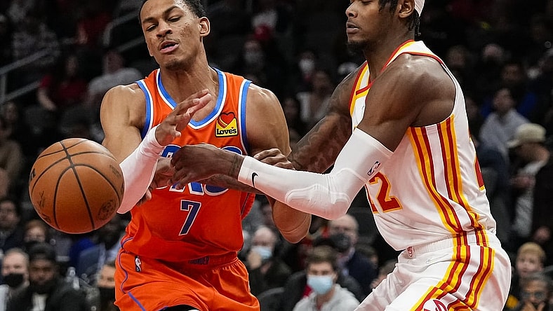 Nov 22, 2021; Atlanta, Georgia, USA; Atlanta Hawks forward Cam Reddish (22) knocks the ball away from Oklahoma City Thunder forward Darius Bazley (7) during the first half at State Farm Arena. Mandatory Credit: Dale Zanine-USA TODAY Sports