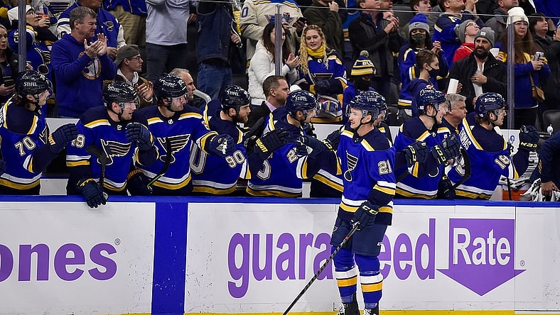 Nov 22, 2021; St. Louis, Missouri, USA;  St. Louis Blues center Tyler Bozak (21) is congratulated by teammates after scoring against the Vegas Golden Knights during the first period at Enterprise Center. Mandatory Credit: Jeff Curry-USA TODAY Sports