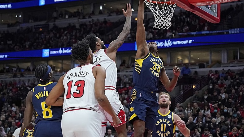 Nov 22, 2021; Chicago, Illinois, USA; Indiana Pacers center Myles Turner (33) blocks Chicago Bulls guard Coby White (0) shot during the first half at United Center. Mandatory Credit: David Banks-USA TODAY Sports