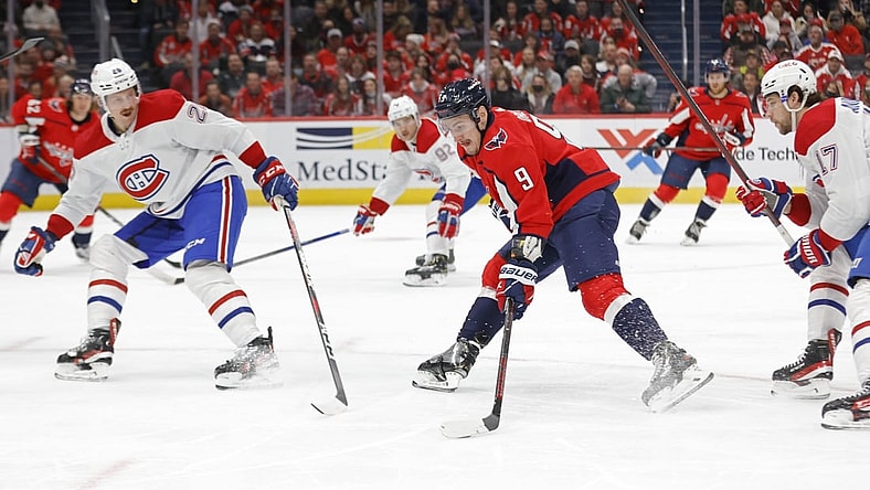 Nov 24, 2021; Washington, District of Columbia, USA; Washington Capitals defenseman Dmitry Orlov (9) skates with the puck as Montreal Canadiens defenseman Jeff Petry (26) during the first period at Capital One Arena. Mandatory Credit: Geoff Burke-USA TODAY Sports