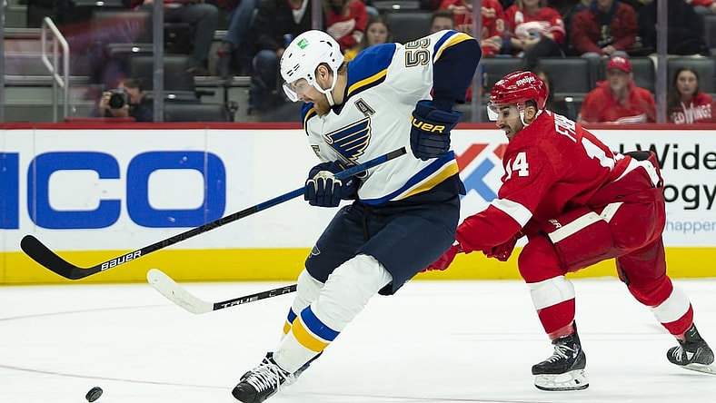 Nov 24, 2021; Detroit, Michigan, USA; St. Louis Blues defenseman Colton Parayko (55) skates past Detroit Red Wings center Robby Fabbri (14) during the first period at Little Caesars Arena. Mandatory Credit: Raj Mehta-USA TODAY Sports
