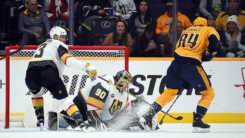 Nov 24, 2021; Nashville, Tennessee, USA; Vegas Golden Knights goalie Robin Lehner (90) makes a save on a shot attempt from Nashville Predators left wing Tanner Jeannot (84) during the second period at Bridgestone Arena. Mandatory Credit: Christopher Hanewinckel-USA TODAY Sports