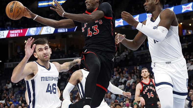 Nov 24, 2021; Memphis, Tennessee, USA; Toronto Raptors forward Pascal Siakam (43) passes the ball as Memphis Grizzles forward Jaren Jackson Jr. (13) defends during the first half at FedExForum. Mandatory Credit: Petre Thomas-USA TODAY Sports