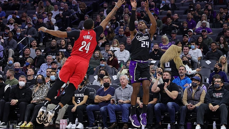 Nov 24, 2021; Sacramento, California, USA; Sacramento Kings guard Buddy Hield (24) shoots the ball over Portland Trail Blazers forward Norman Powell (24) during the fourth quarter at Golden 1 Center. Mandatory Credit: Sergio Estrada-USA TODAY Sports