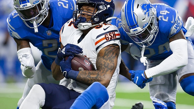 Nov 25, 2021; Detroit, Michigan, USA; Chicago Bears running back David Montgomery (32) gets tackeld by Detroit Lions cornerback Amani Oruwariye (24) and free safety Tracy Walker III (21) during the first quarter at Ford Field. Mandatory Credit: Raj Mehta-USA TODAY Sports