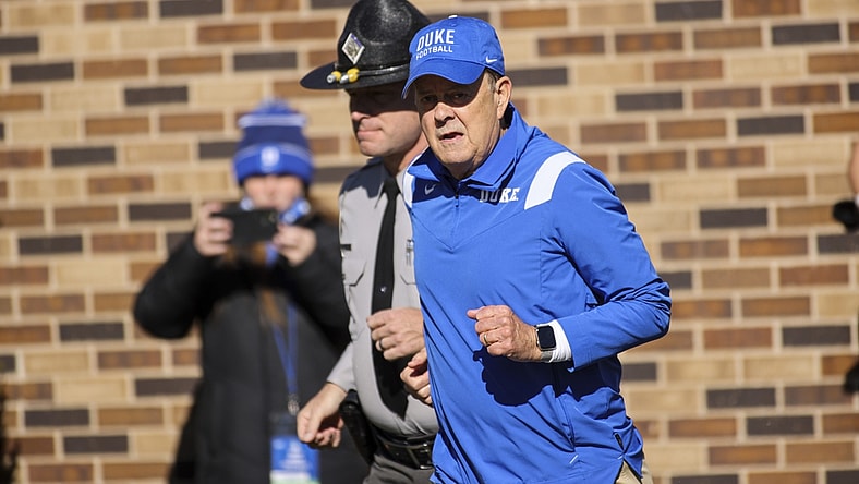Nov 27, 2021; Durham, North Carolina, USA;  Duke Blue Devils head coach David Cutcliffe runs out during the first half of the game against the Miami Hurricanes at Wallace Wade Stadium. at Wallace Wade Stadium. Mandatory Credit: Jaylynn Nash-USA TODAY Sports