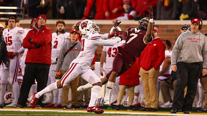 Nov 27, 2021; Minneapolis, Minnesota, USA; Wisconsin Badgers cornerback Alexander Smith (11) breaks up a pass intended for Minnesota Gophers wide receiver Chris Autman-Bell (7) during the second quarter at Huntington Bank Stadium. Mandatory Credit: Harrison Barden-USA TODAY Sports