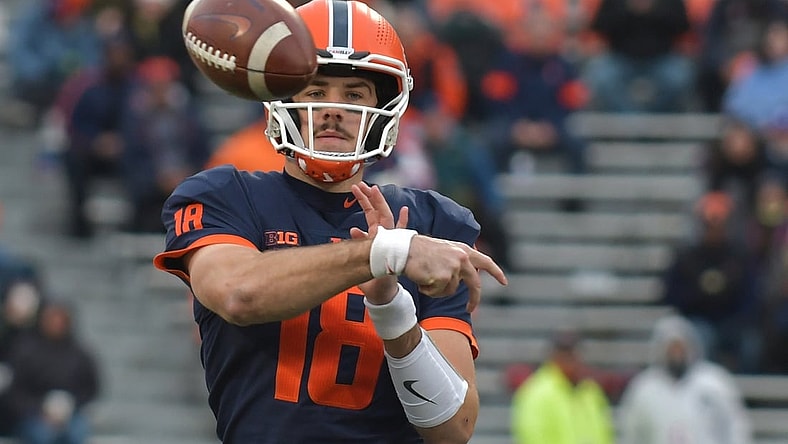 Nov 27, 2021; Champaign, Illinois, USA;  Illinois Fighting Illini quarterback Brandon Peters (18) passes  the ball during the first half against the Northwestern Wildcats  at Memorial Stadium. Mandatory Credit: Ron Johnson-USA TODAY Sports