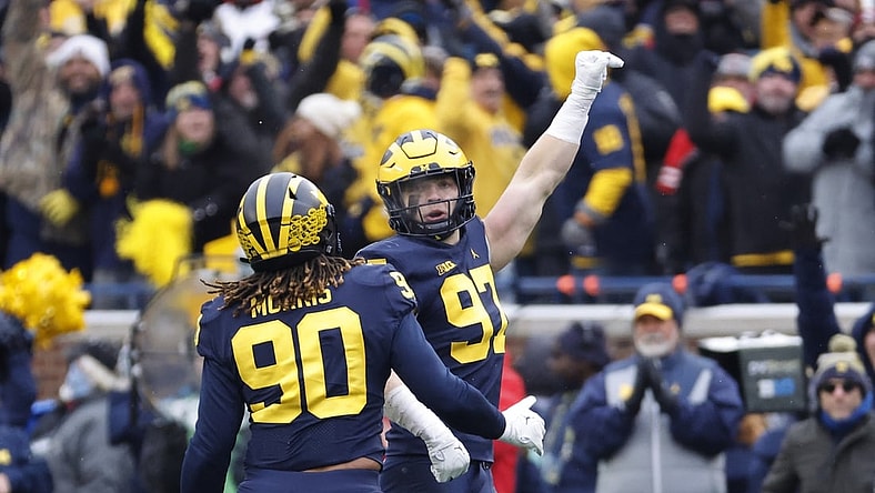 Nov 27, 2021; Ann Arbor, Michigan, USA; Michigan Wolverines defensive end Aidan Hutchinson (97) celebrates his sad of Ohio State Buckeyes quarterback C.J. Stroud (not pictured) with defensive end Mike Morris (90) in the second half in the second half at Michigan Stadium. Mandatory Credit: Rick Osentoski-USA TODAY Sports