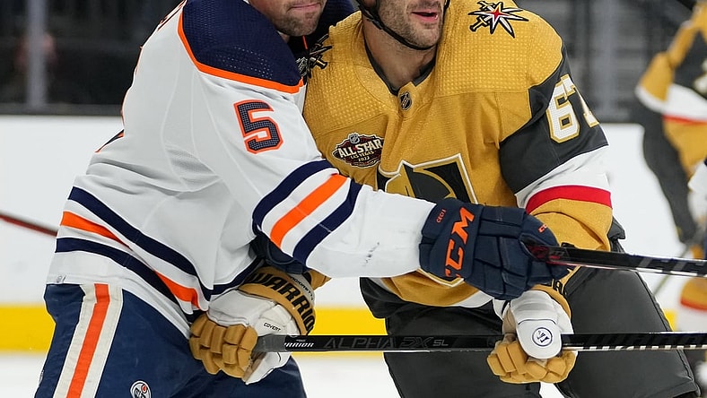 Nov 27, 2021; Las Vegas, Nevada, USA; Edmonton Oilers defenseman Cody Ceci (5) covers Vegas Golden Knights left wing Max Pacioretty (67) during the first period at T-Mobile Arena. Mandatory Credit: Stephen R. Sylvanie-USA TODAY Sports