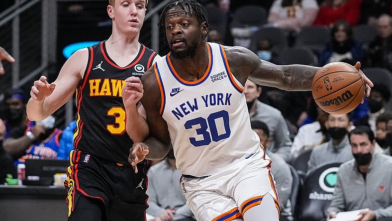 Nov 27, 2021; Atlanta, Georgia, USA; New York Knicks forward Julius Randle (30) dribbles against Atlanta Hawks guard Kevin Huerter (3) during the first half at State Farm Arena. Mandatory Credit: Dale Zanine-USA TODAY Sports