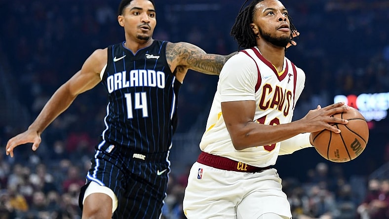 Nov 27, 2021; Cleveland, Ohio, USA; Cleveland Cavaliers guard Darius Garland (10) drives to the basket against Orlando Magic guard Gary Harris (14) during the first half at Rocket Mortgage FieldHouse. Mandatory Credit: Ken Blaze-USA TODAY Sports