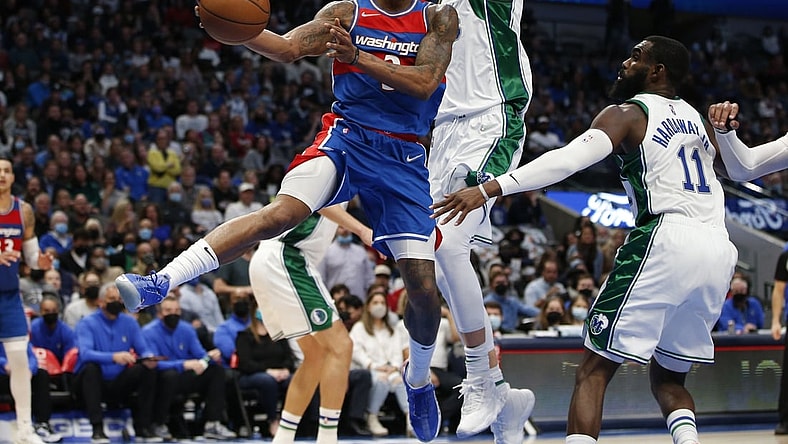 Nov 27, 2021; Dallas, Texas, USA; Washington Wizards guard Bradley Beal (3) passes the ball against Dallas Mavericks center Kristaps Porzingis (6) in the fourth quarter at American Airlines Center. Mandatory Credit: Tim Heitman-USA TODAY Sports