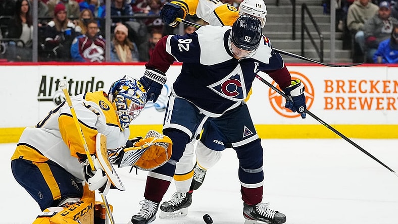 Nov 27, 2021; Denver, Colorado, USA; Nashville Predators goaltender David Rittich (33) and defenseman Mattias Ekholm (14) defend the goal against Colorado Avalanche left wing Gabriel Landeskog (92) in the second period at Ball Arena. Mandatory Credit: Ron Chenoy-USA TODAY Sports