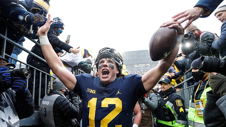 Nov 27, 2021; Ann Arbor, MI, USA; Michigan quarterback Cade McNamara celebrates with fans as he walks up the tunnel after Michigan's 42-27 win over Ohio State on Saturday, Nov. 27, 2021, at Michigan Stadium. Mandatory Credit: Junfu Han-USA TODAY Sports
