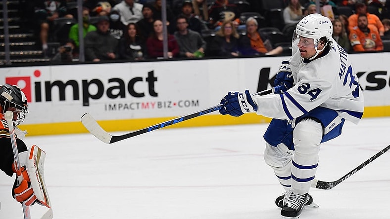 Nov 28, 2021; Anaheim, California, USA; Toronto Maple Leafs center Auston Matthews (34) shoots on goal against Anaheim Ducks goaltender John Gibson (36) during the second period at Honda Center. Mandatory Credit: Gary A. Vasquez-USA TODAY Sports