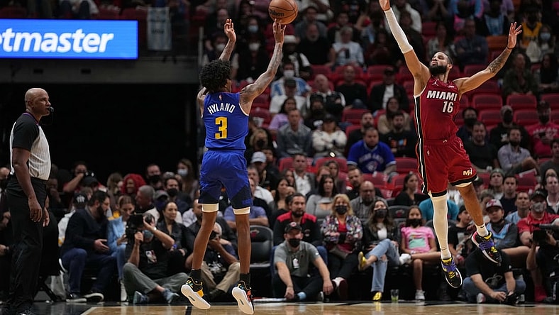 Nov 29, 2021; Miami, Florida, USA; Denver Nuggets guard Bones Hyland (3) shoots the ball over Miami Heat forward Caleb Martin (16) during the first half at FTX Arena. Mandatory Credit: Jasen Vinlove-USA TODAY Sports