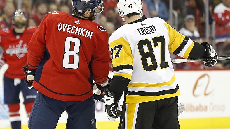 Nov 7, 2018; Washington, DC, USA; Pittsburgh Penguins center Sidney Crosby (87) and Washington Capitals left wing Alex Ovechkin (8) talk with referee Wes McCauley (4) in the third period at Capital One Arena. Mandatory Credit: Geoff Burke-USA TODAY Sports