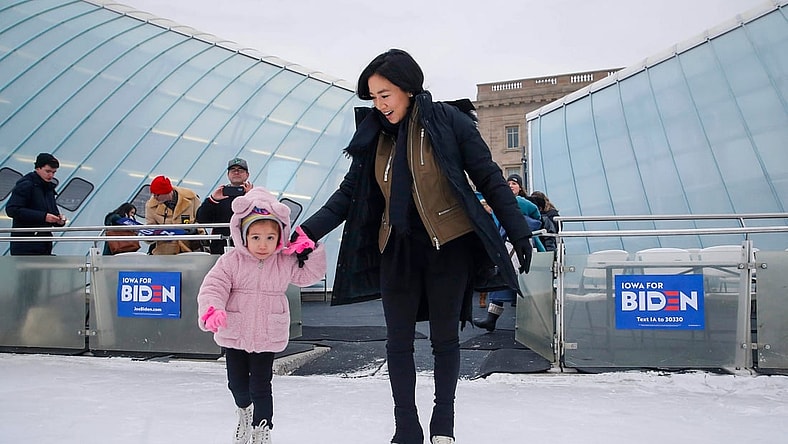 Avery Collins, 4, of Waukee leads Olympic figure skater Michelle Kwan onto the ice at Brenton Skating Plaza in Des Moines on Saturday, Dec. 14, 2019. Kwan, a supporter of Vice President Joe Biden, was in town to fire up support for Biden's run to be the democratic presidential candidate.

20191214 Michellekwan