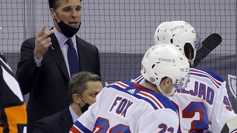 Mar 9, 2021; Pittsburgh, Pennsylvania, USA;  New York Rangers head coach David Quinn (left) talks to his team during a time-out against the Pittsburgh Penguins in the third period at PPG Paints Arena. The Penguins won 4-2. Mandatory Credit: Charles LeClaire-USA TODAY Sports