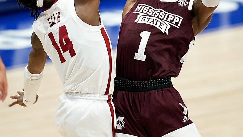 Alabama guard Keon Ellis (14) blocks a shot from Mississippi State guard Iverson Molinar (1) during the first half of the SEC Men's Basketball Tournament game at Bridgestone Arena in Nashville, Tenn., Friday, March 12, 2021.

Ms Ala Sec 031221 An 017