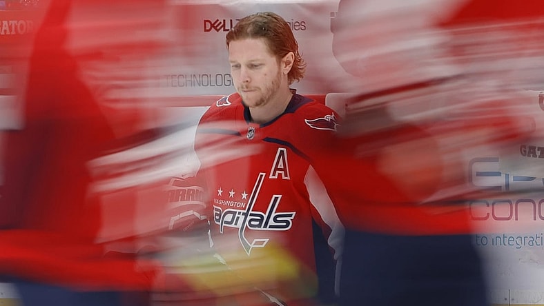 Apr 27, 2021; Washington, District of Columbia, USA; Washington Capitals center Nicklas Backstrom (19) kneels on the ice during warmups prior to the Capitals' game against the New York Islanders at Capital One Arena. Mandatory Credit: Geoff Burke-USA TODAY Sports