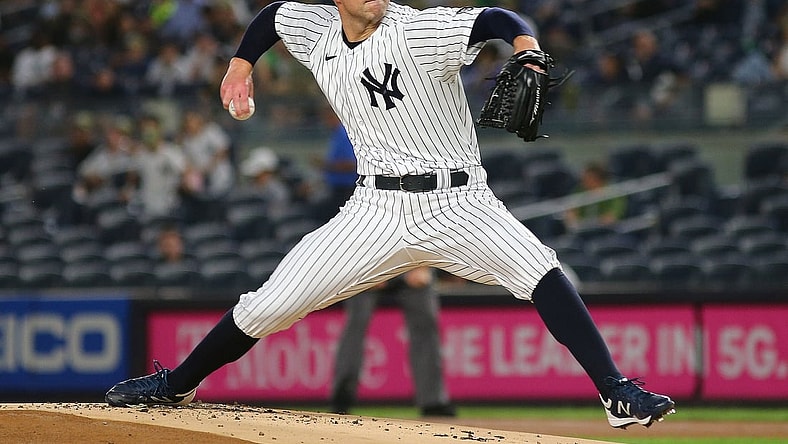 Sep 17, 2021; Bronx, New York, USA; New York Yankees starting pitcher Corey Kluber (28) pitches against the Cleveland Indians during the first inning at Yankee Stadium. Mandatory Credit: Andy Marlin-USA TODAY Sports