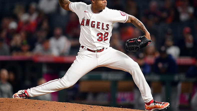 Sep 23, 2021; Anaheim, California, USA; Los Angeles Angels relief pitcher Raisel Iglesias (32) throws against the Houston Astros during the ninth inning at Angel Stadium. Mandatory Credit: Gary A. Vasquez-USA TODAY Sports
