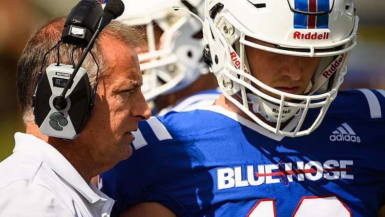 Presbyterian College head coach Kevin Kelley speaks with quarterback Ren Hefley (12) during their game against Morehead State at Bailey Memorial Stadium Saturday, Oct. 9, 2021.

Jm Prescollege 101221 007