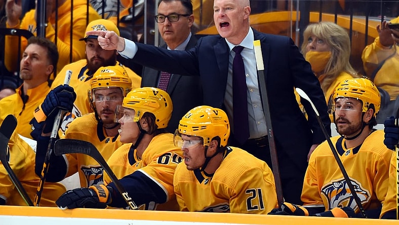 Oct 16, 2021; Nashville, Tennessee, USA; Nashville Predators head coach John Hynes yells from the bench during the first period against the Carolina Hurricanes at Bridgestone Arena. Mandatory Credit: Christopher Hanewinckel-USA TODAY Sports
