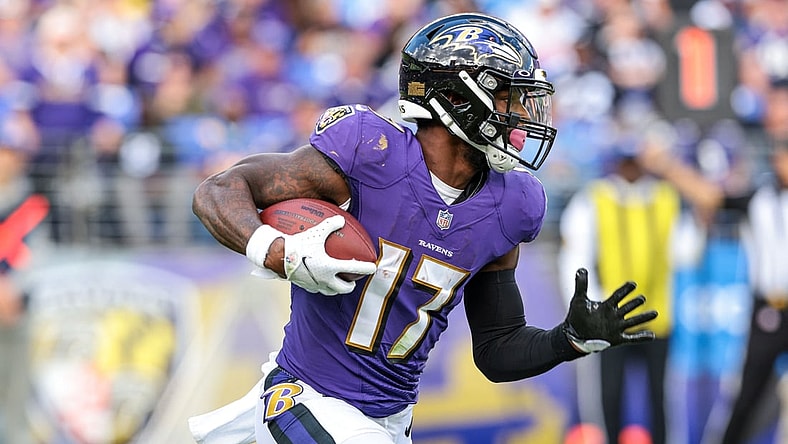Oct 17, 2021; Baltimore, Maryland, USA; Baltimore Ravens running back Le'Veon Bell (17) carries the ball against the Los Angeles Chargers during the second half at M&T Bank Stadium. Mandatory Credit: Vincent Carchietta-USA TODAY Sports