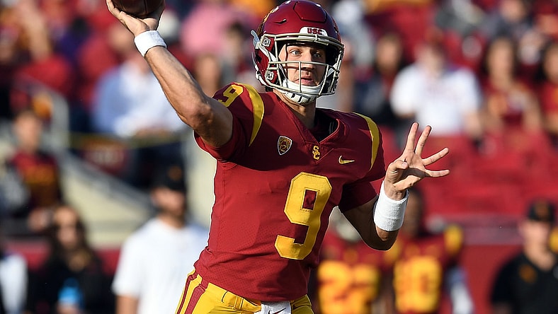 Oct 30, 2021; Los Angeles, California, USA; Southern California Trojans quarterback Kedon Slovis (9) throws against the Arizona Wildcats during the first half at United Airlines Field at Los Angeles Memorial Coliseum. Mandatory Credit: Gary A. Vasquez-USA TODAY Sports
