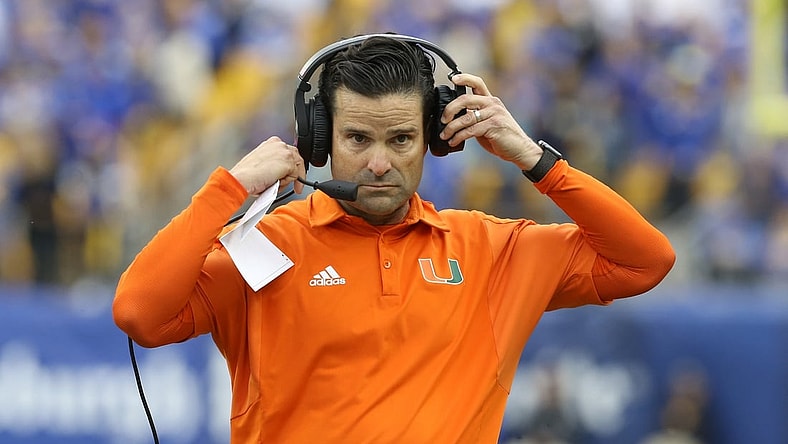 Oct 30, 2021; Pittsburgh, Pennsylvania, USA;  Miami Hurricanes head coach Manny Diaz puts his headset on against the Pittsburgh Panthers during the fourth quarter at Heinz Field. Mandatory Credit: Charles LeClaire-USA TODAY Sports