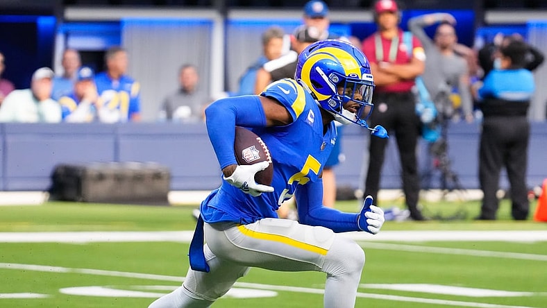 Oct 24, 2021; Inglewood, California, USA; Los Angeles Rams cornerback Jalen Ramsey (5) runs back an interception in the fourth quarter against the Detroit Lions  at SoFi Stadium. Mandatory Credit: Robert Hanashiro-USA TODAY Sports