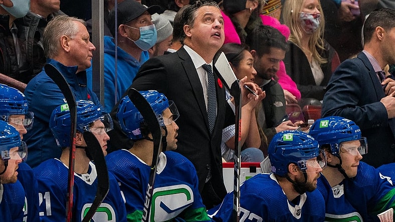 Nov 9, 2021; Vancouver, British Columbia, CAN; Vancouver Canucks head coach Travis Green on the bench against the Anaheim Ducks at Rogers Arena. Mandatory Credit: Bob Frid-USA TODAY Sports